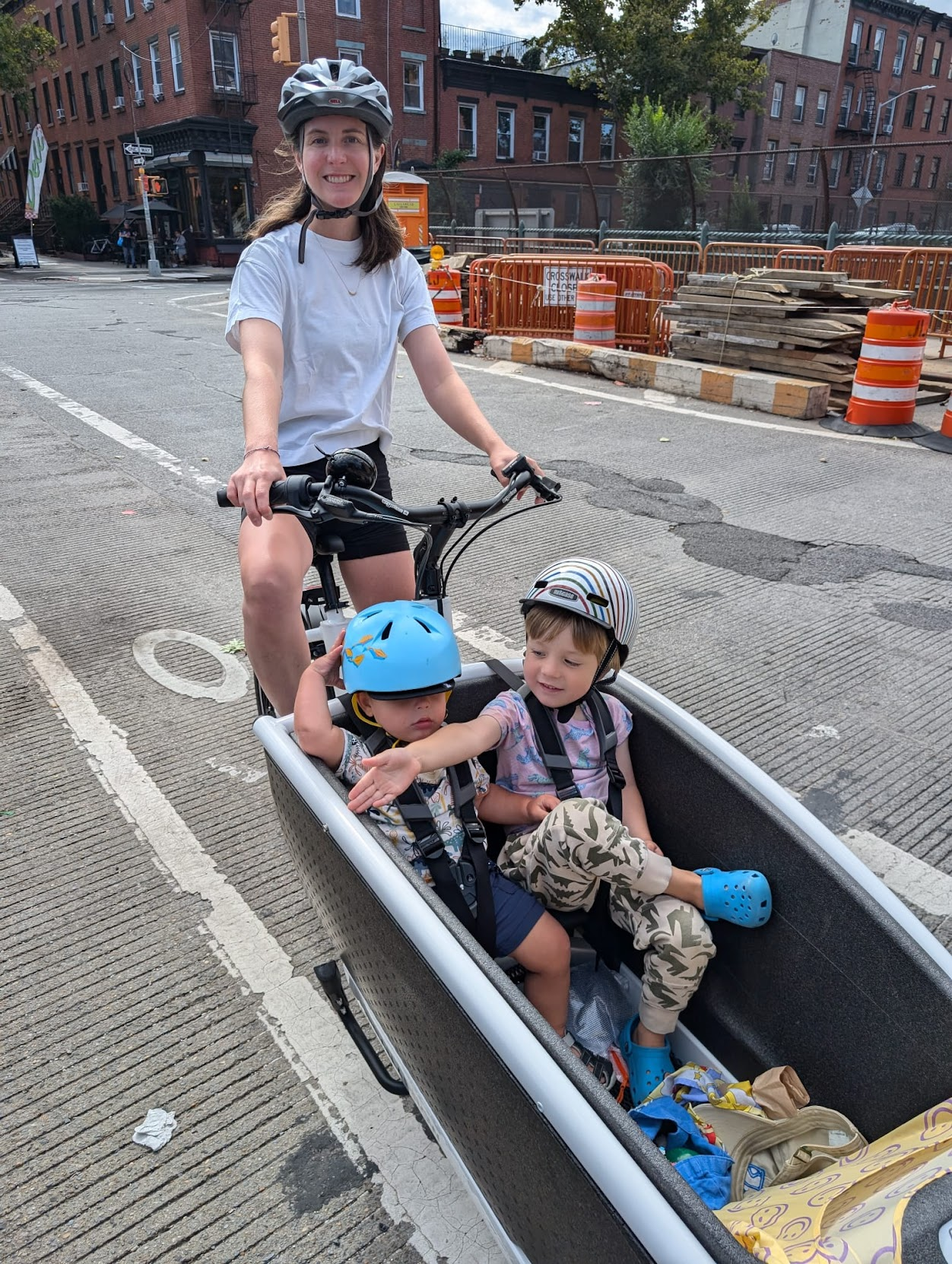 Katie Conneally riding her Urban Arrow with her kids through Brooklyn